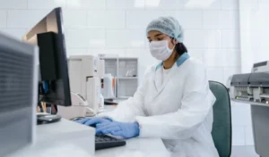 scientist typing on computer